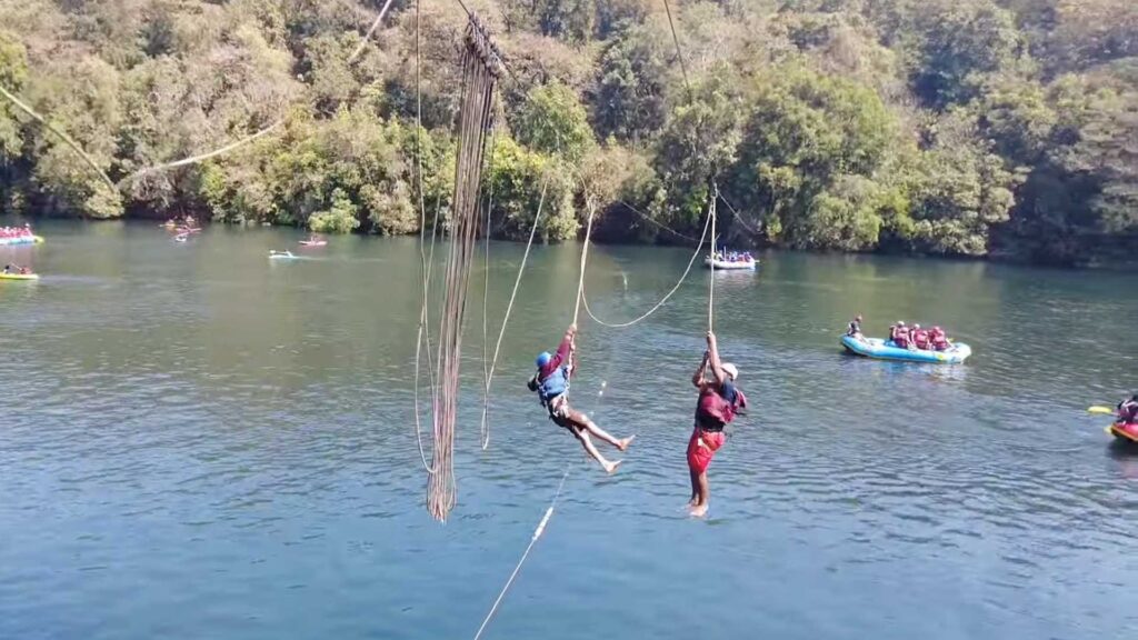 Going through a zip line from one bank of the Dandeli river to the other